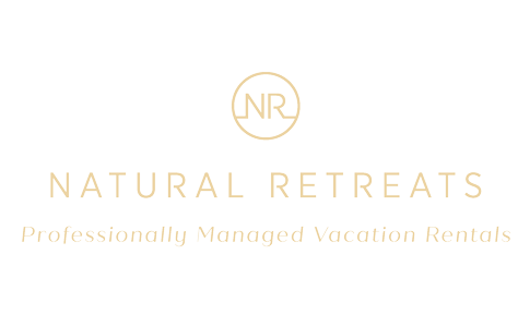 natural retreats profressionally managed vacation rentals logo small gold circle with the letters N R inside