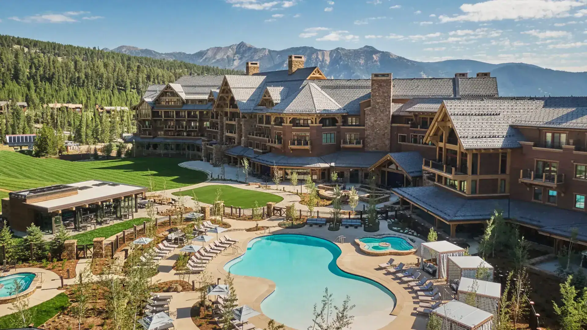 Montage Big Sky resort and pool beneath the Spanish Peaks