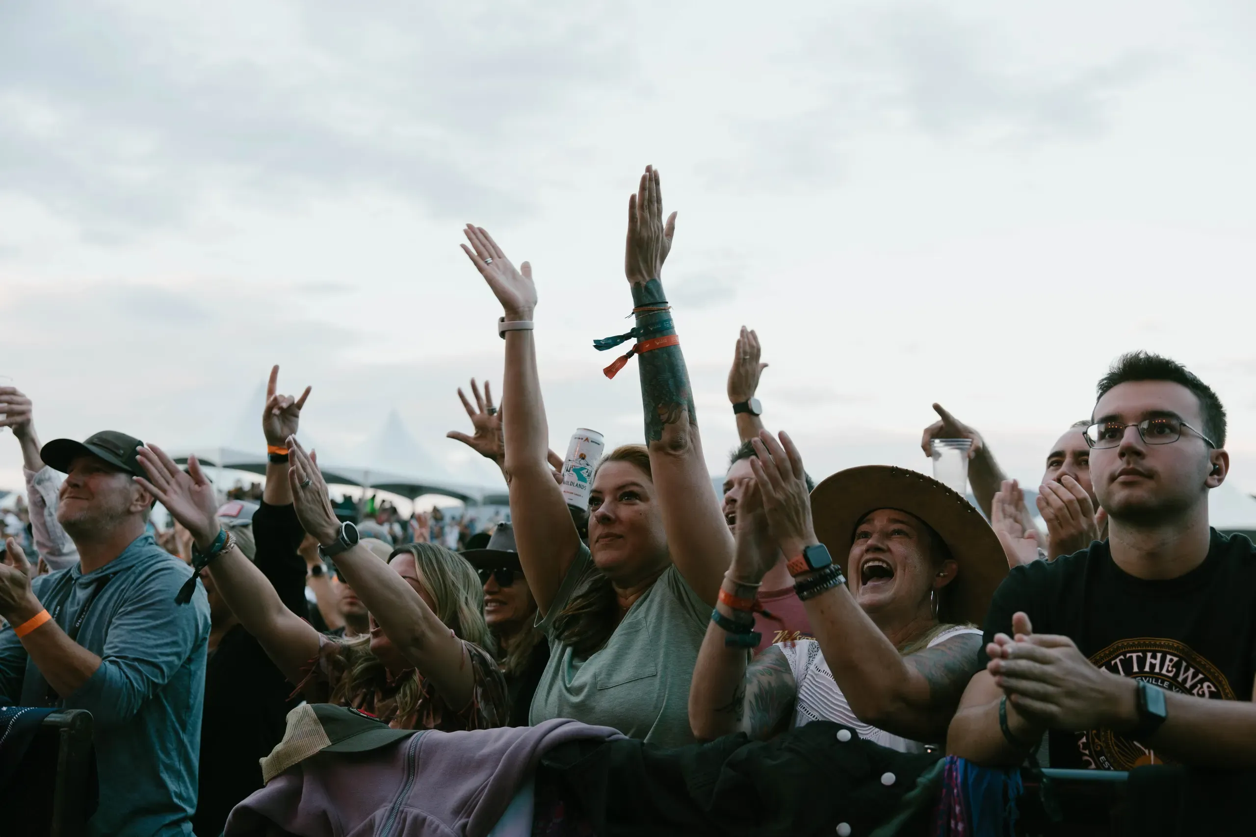 Audience members facing the Wildlands stage across the outdoor venue.