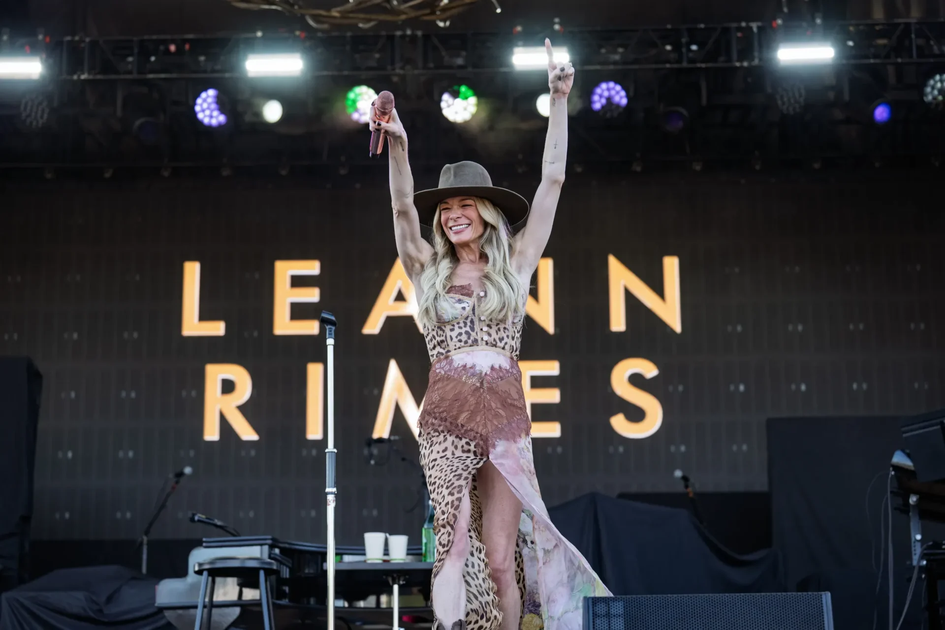 LeAnn Rimes at Wildlands. A singer raising her arms above her head on the Wildlands stage.